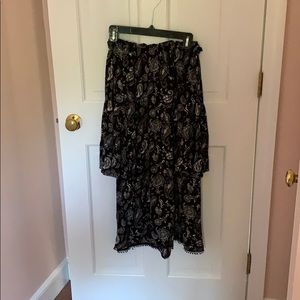 Off shoulder black paisley dress.